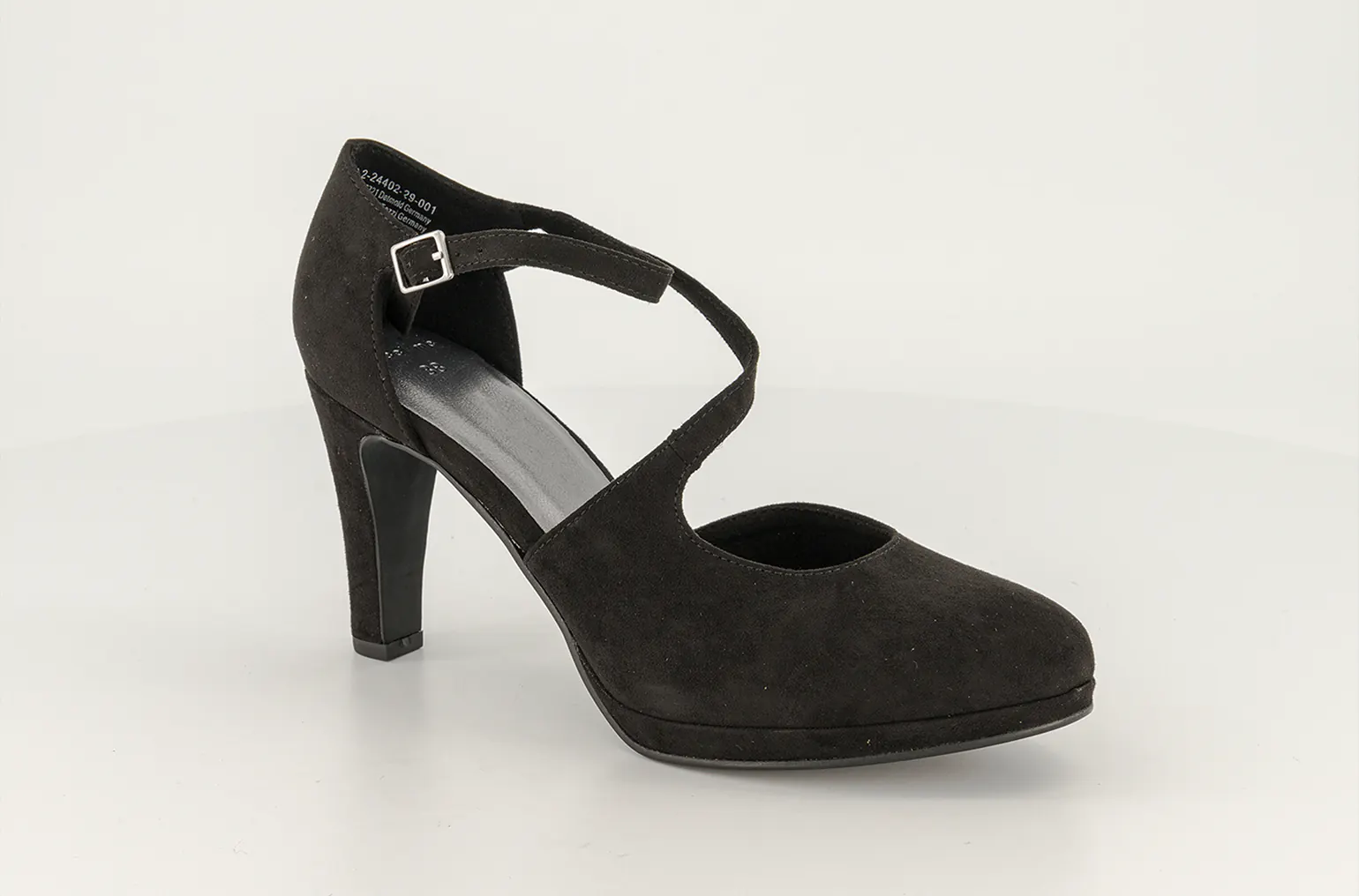 A black heel on a grey studio background